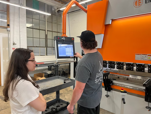 two-person-with-machine